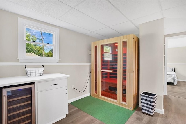 216 Pineview Cir, Agawam, MA 01001 - bar featuring wine cooler, wood finished floors, baseboards, plenty of natural light, and a drop ceiling