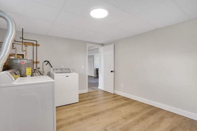 216 Pineview Cir, Agawam, MA 01001 - laundry room featuring washer and clothes dryer, light wood finished floors, baseboards, and electric water heater