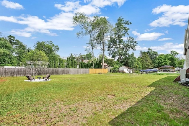 216 Pineview Cir, Agawam, MA 01001 - view of yard featuring an outdoor fire pit