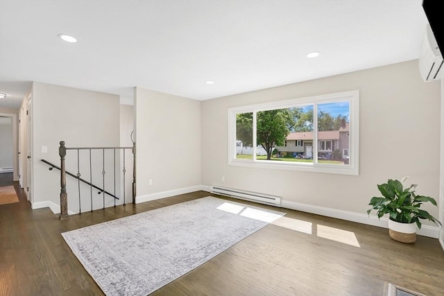 216 Pineview Cir, Agawam, MA 01001 - empty room with a baseboard heating unit, baseboards, a wall mounted air conditioner, dark wood-style flooring, and recessed lighting