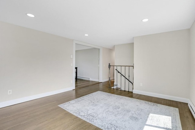 216 Pineview Cir, Agawam, MA 01001 - unfurnished room featuring baseboard heating, wood finished floors, baseboards, and recessed lighting