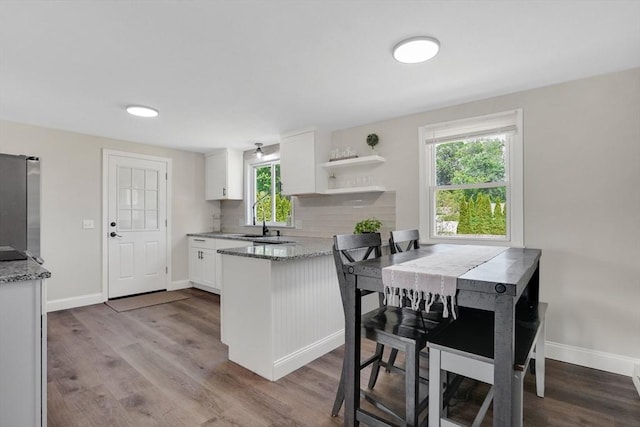 216 Pineview Cir, Agawam, MA 01001 - kitchen featuring white cabinets, refrigerator, light stone countertops, and healthy amount of natural light