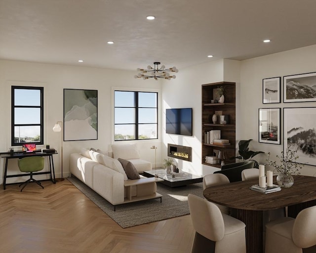 living room featuring light parquet flooring and a notable chandelier