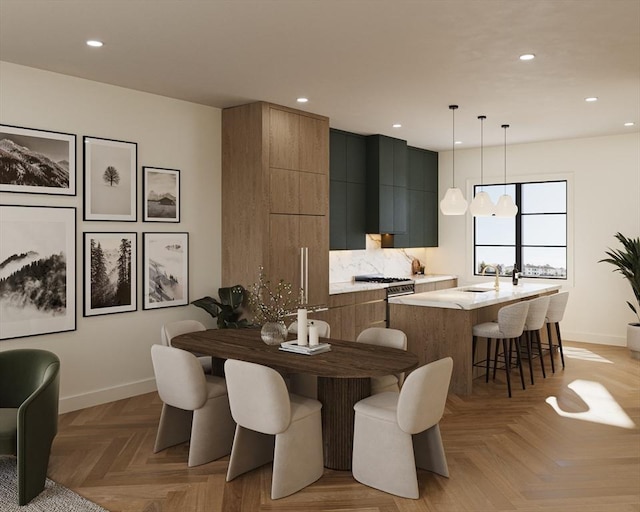 dining space with sink and light parquet floors