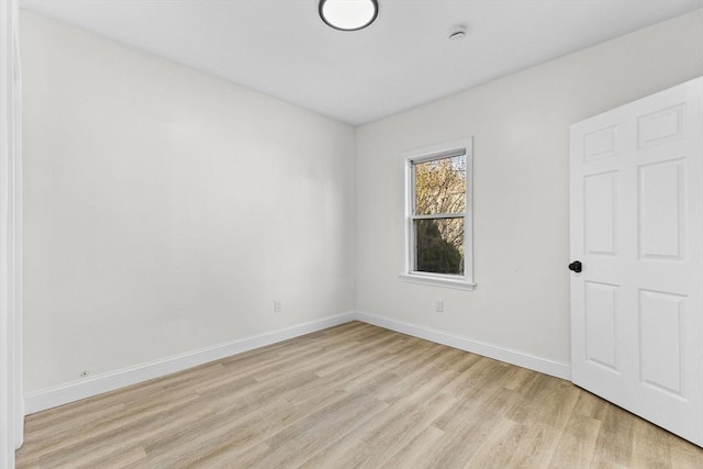 empty room with light wood-type flooring