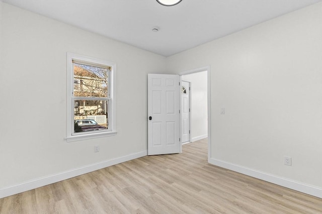 spare room featuring light wood-type flooring