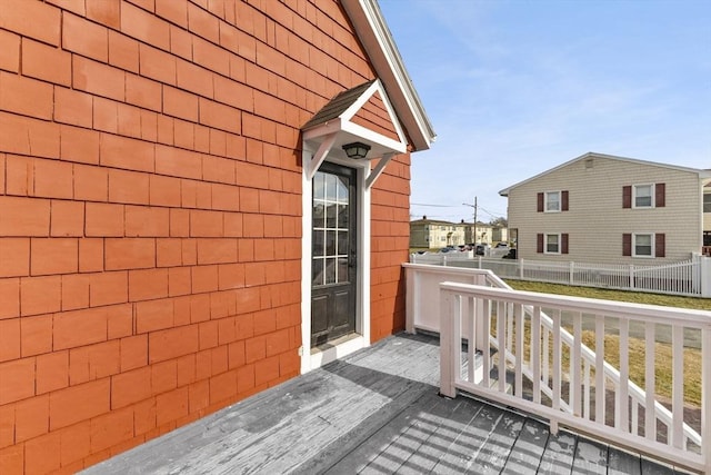 wooden balcony featuring a deck