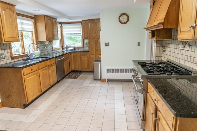 118 Dudley Ln, Milton, MA 02186 - kitchen with stainless steel appliances, a sink, radiator heating unit, premium range hood, and backsplash