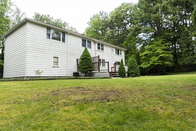 118 Dudley Ln, Milton, MA 02186 - view of front of home with a front yard, a deck, and central AC