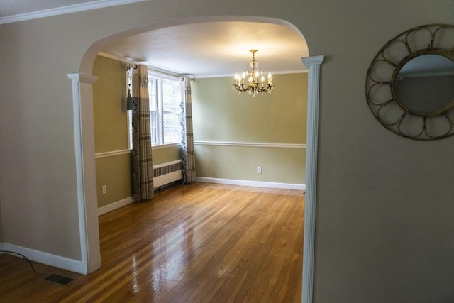 118 Dudley Ln, Milton, MA 02186 - unfurnished room featuring arched walkways, wood finished floors, a chandelier, crown molding, and radiator