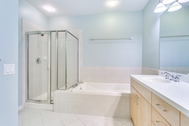 bathroom with tile patterned flooring, vanity, and independent shower and bath