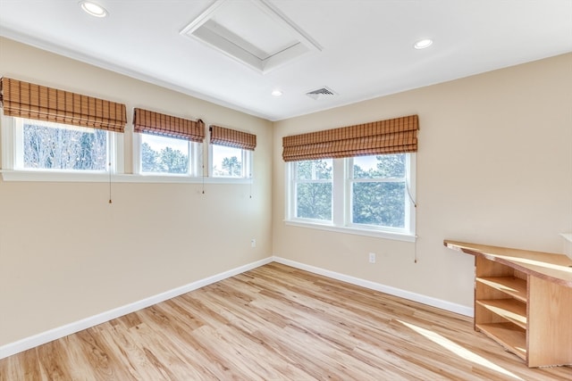 empty room with light hardwood / wood-style floors