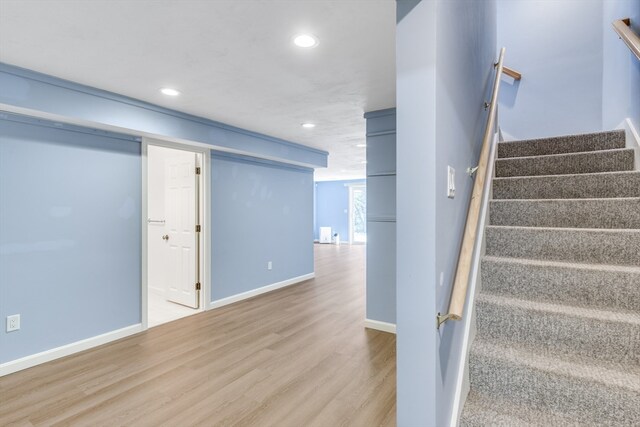 staircase featuring hardwood / wood-style floors