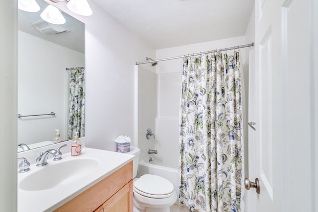 full bathroom with shower / tub combo with curtain, vanity, and toilet