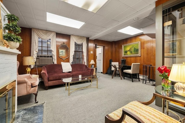 carpeted living room featuring cooling unit and wood walls