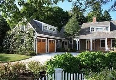 25 Richard Ln, Eastham, MA 02642 - rear view of property featuring driveway and a chimney