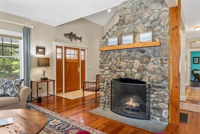 25 Richard Ln, Eastham, MA 02642 - living room with wood finished floors, a stone fireplace, and high vaulted ceiling