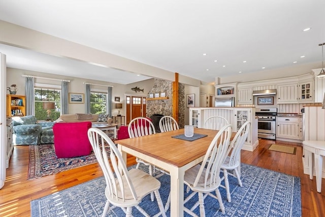 25 Richard Ln, Eastham, MA 02642 - dining room featuring light wood-style floors, a stone fireplace, and recessed lighting
