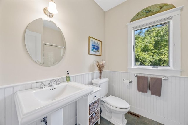 25 Richard Ln, Eastham, MA 02642 - bathroom featuring wainscoting and tile patterned floors