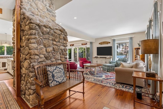 25 Richard Ln, Eastham, MA 02642 - living area with hardwood / wood-style flooring, plenty of natural light, recessed lighting, and a stone fireplace