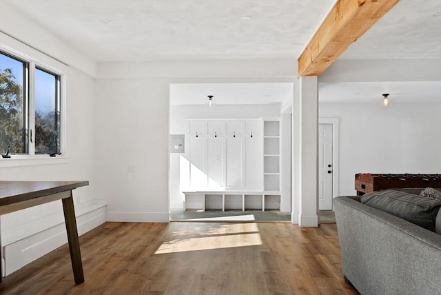 mudroom featuring beamed ceiling, baseboards, and wood finished floors