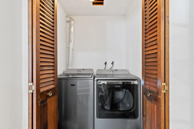 laundry room with laundry area and separate washer and dryer