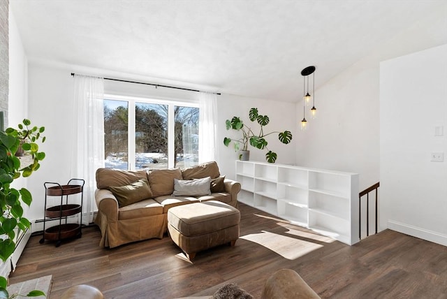 living room with baseboards, vaulted ceiling, and dark wood-style flooring