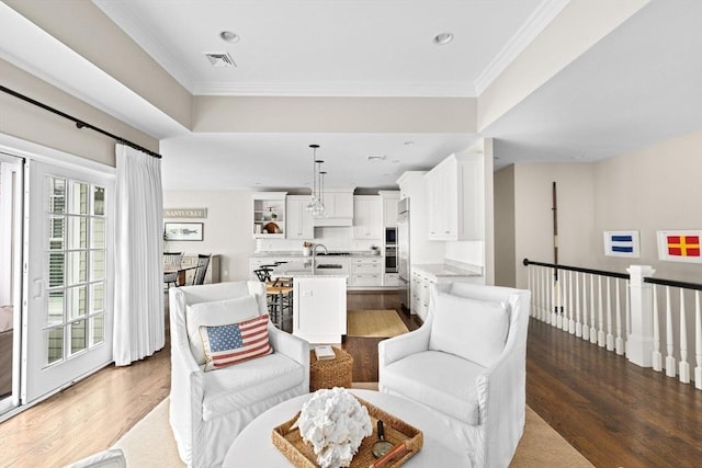 90 Chittenden Ln Unit 90, Cohasset, MA 02025 - living room featuring wood finished floors, crown molding, and recessed lighting
