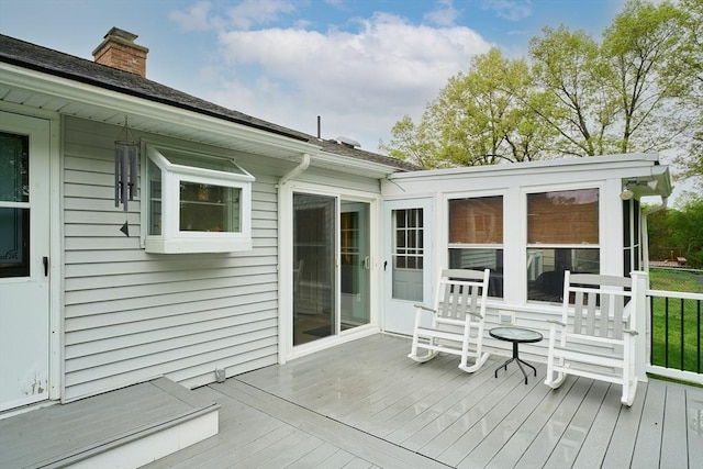 deck with a sunroom