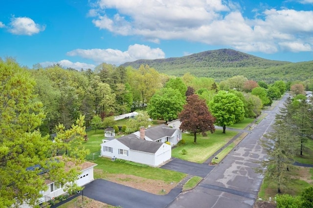view from above of property featuring a heavily wooded area