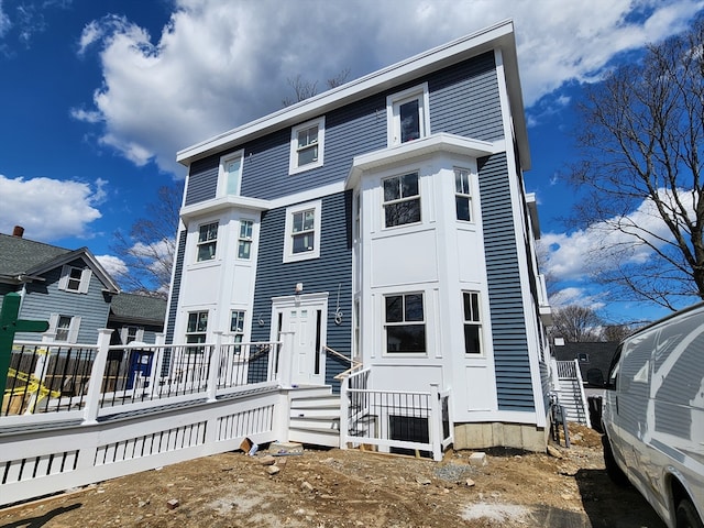 view of front of home with a wooden deck