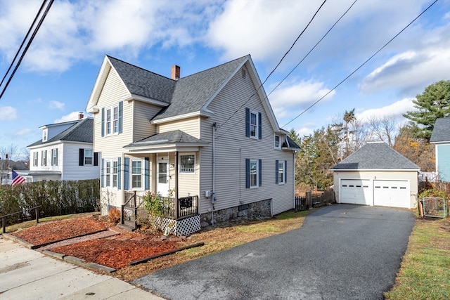 front of property featuring an outbuilding and a garage