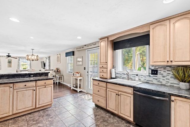 kitchen featuring light brown cabinetry, dishwasher, dark wood-type flooring, pendant lighting, and sink