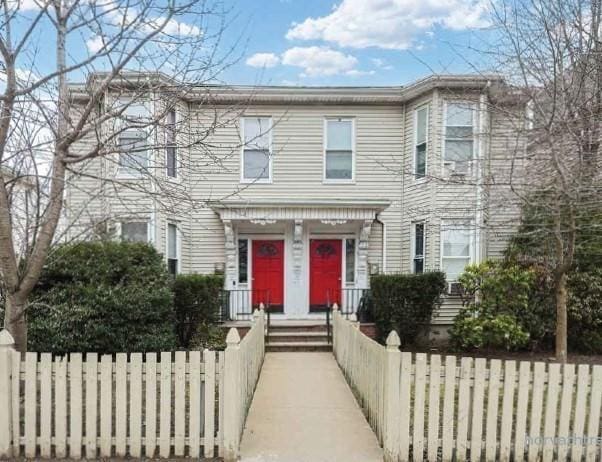 view of front facade with a fenced front yard