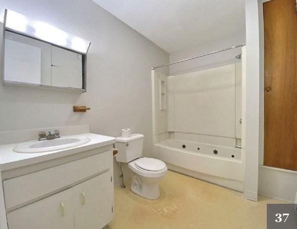 full bathroom with toilet, bathtub / shower combination, and vanity