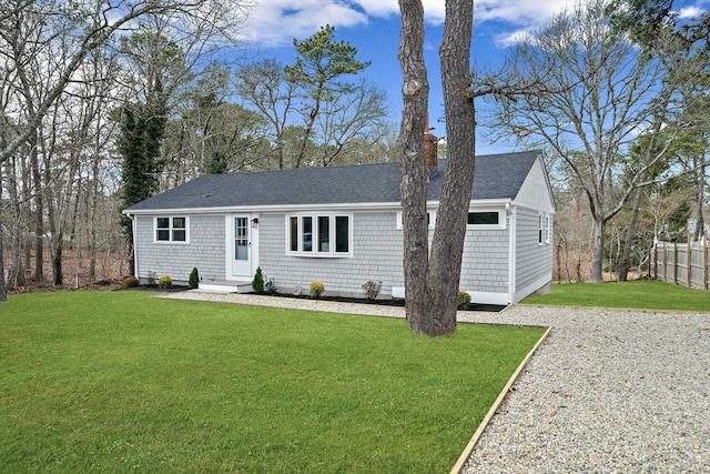 6 Raintree Rd, Dennis, MA 02639 - view of front of house featuring a chimney and a shingled roof