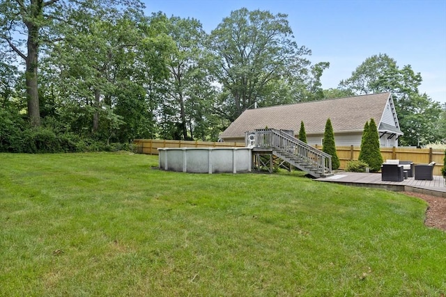 74 Glendale Rd, Braintree, MA 02184 - view of yard featuring a deck, an outdoor pool, and stairs