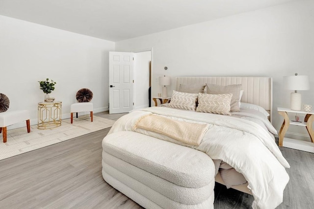 bedroom with hardwood / wood-style flooring