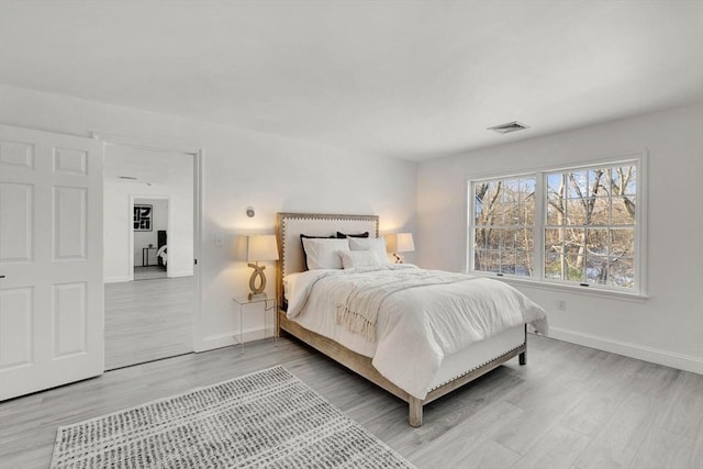 bedroom with hardwood / wood-style floors