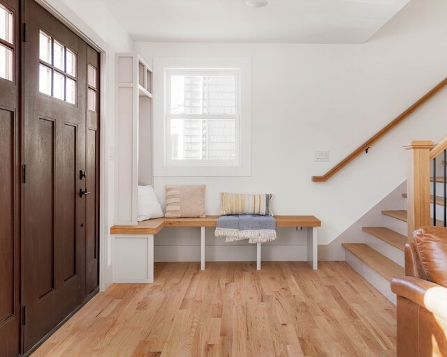 mudroom with light hardwood / wood-style flooring