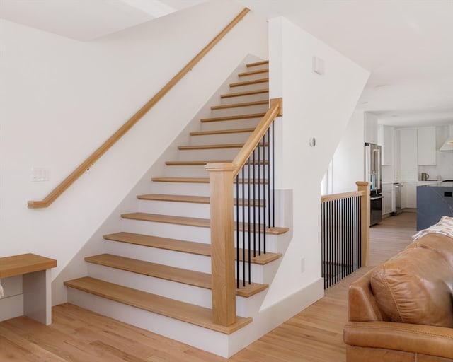 stairway featuring hardwood / wood-style flooring