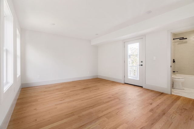 spare room with light wood-type flooring