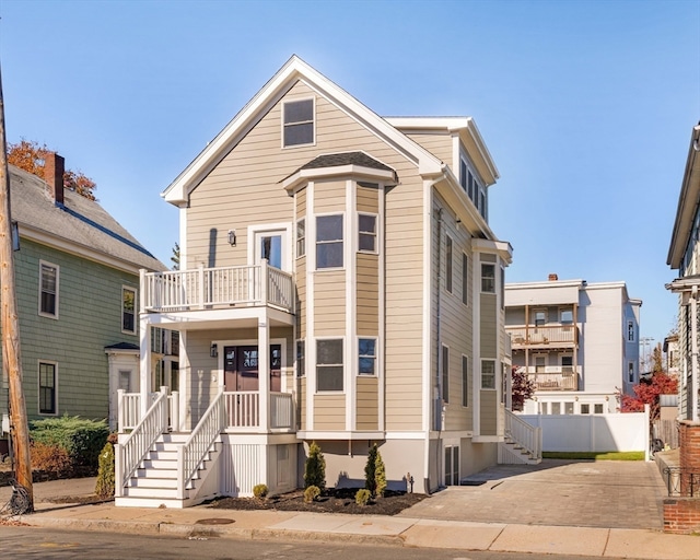 view of front of house with a balcony