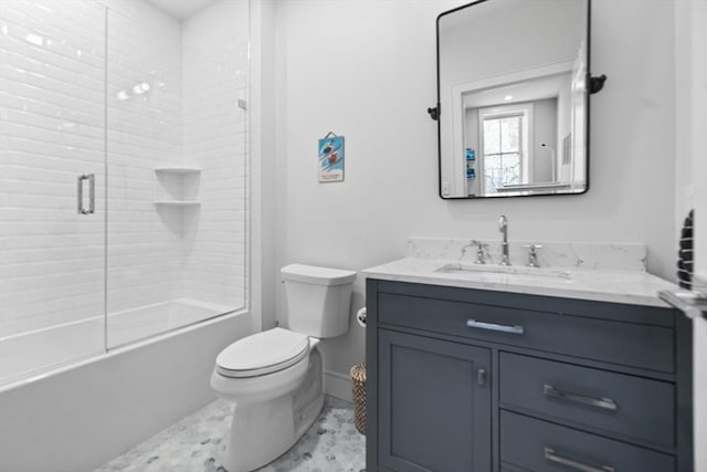 full bathroom featuring vanity, toilet, and combined bath / shower with glass door