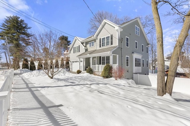 view of front of home featuring covered porch, an attached garage, and fence