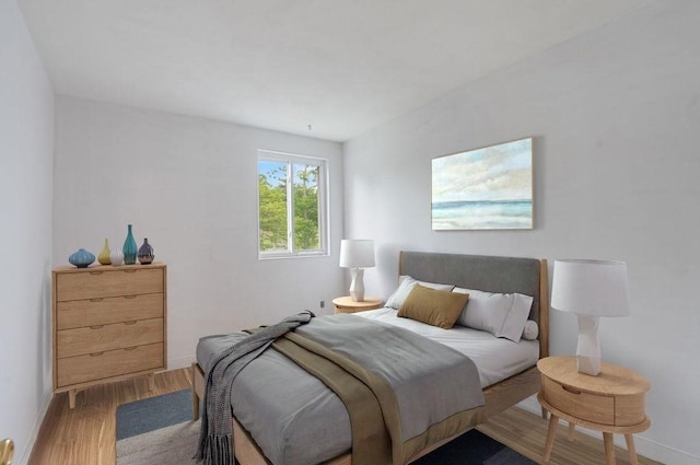 1 Charles St Unit W, Reading, MA 01867 - bedroom featuring wood finished floors and baseboards