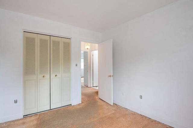 1 Charles St Unit W, Reading, MA 01867 - unfurnished bedroom with baseboards and a closet