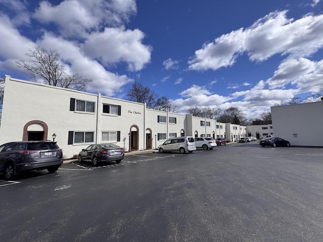 1 Charles St Unit W, Reading, MA 01867 - view of building exterior featuring uncovered parking