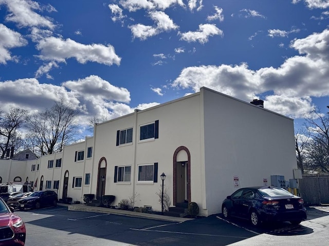 1 Charles St Unit W, Reading, MA 01867 - view of building exterior featuring uncovered parking