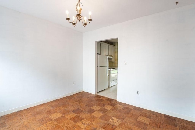 1 Charles St Unit W, Reading, MA 01867 - spare room featuring a chandelier and baseboards